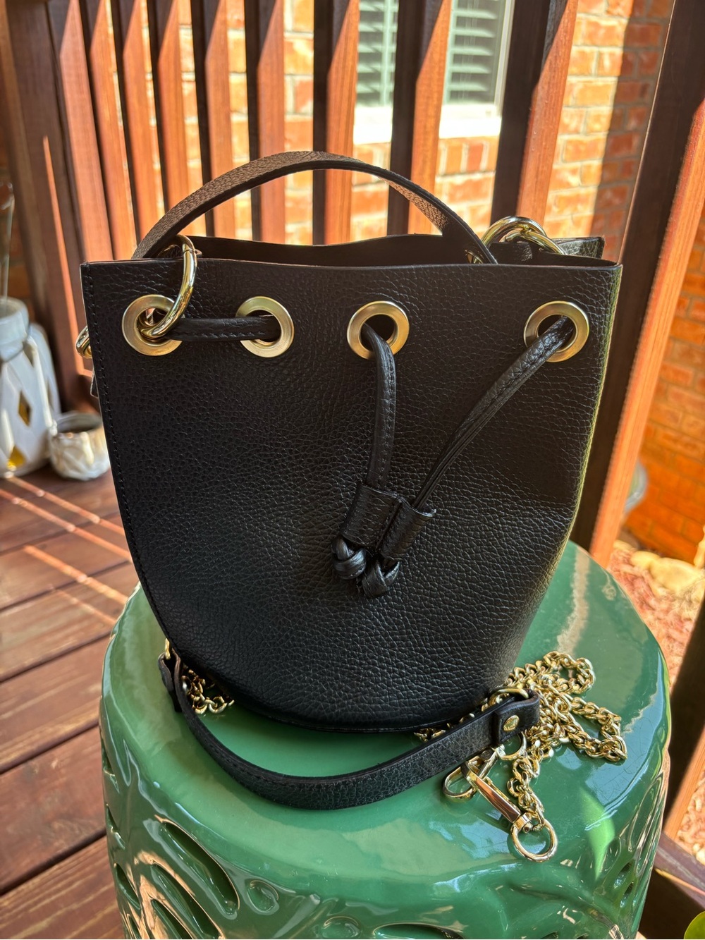 Minimalist Diva’s DV Black Leather Mini Bucket Bag with Gold Hardware